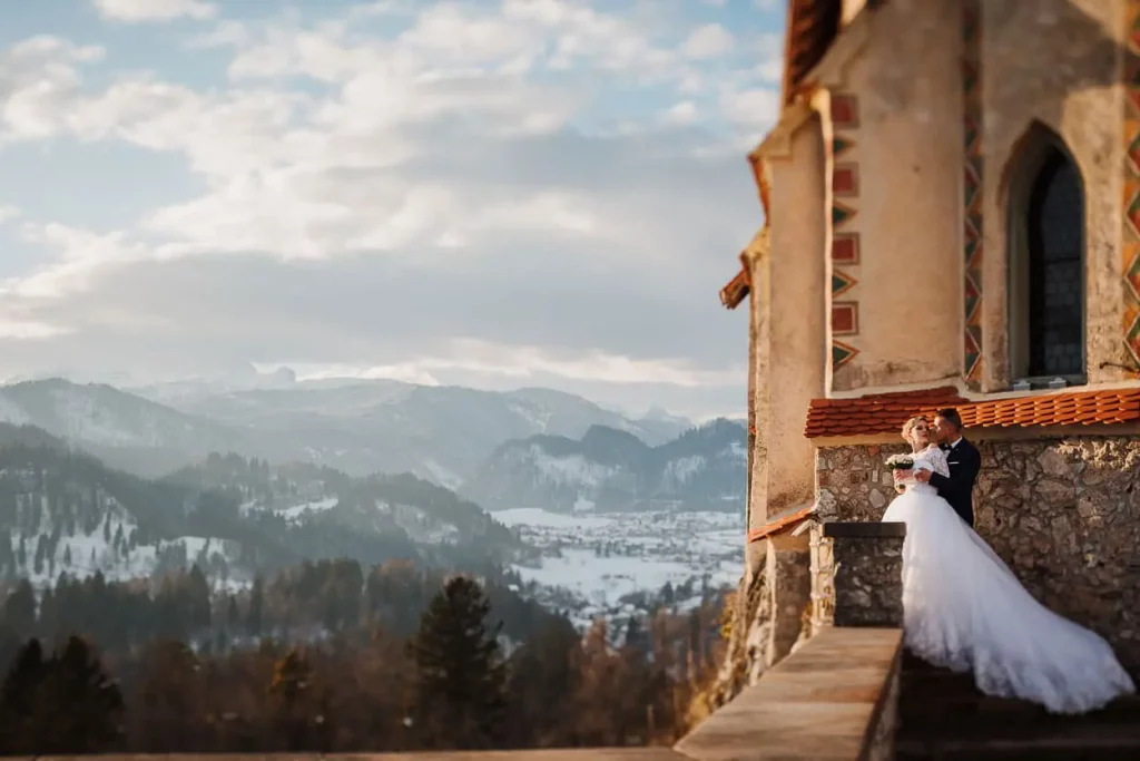 Bride and groom on lake bled castle