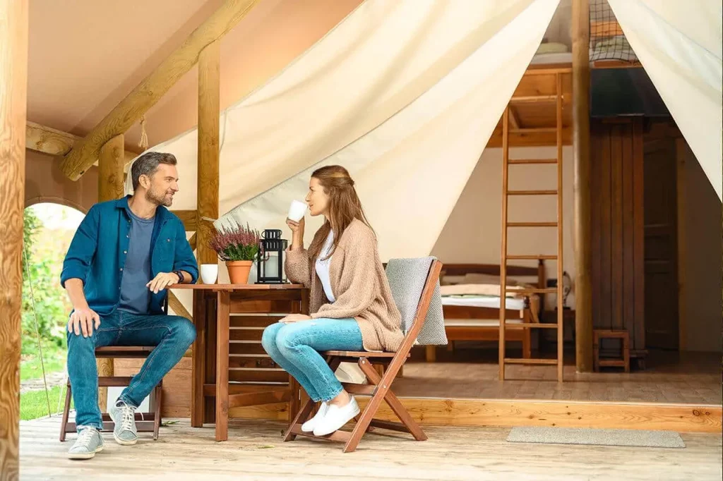 Garden village couplde drinking coffee